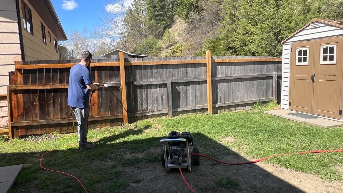 Fence pressure washing before painting